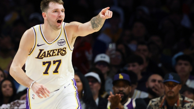 Los Angeles Lakers guard Luka Doncic (77) reacts after scoring a basket against the Miami Heat during the second half of an NBA basketball game, Sunday, Nov. 2, 2025, in Los Angeles. (AP Photo/Jessie Alcheh)