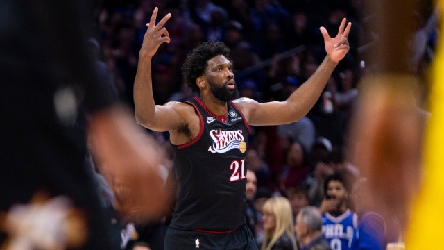 Philadelphia 76ers' Joel Embiid reacts after his 3-point basket during the first half of an NBA basketball game against the Indiana Pacers, Friday, Dec. 12, 2025, in Philadelphia. (AP Photo/Chris Szagola)