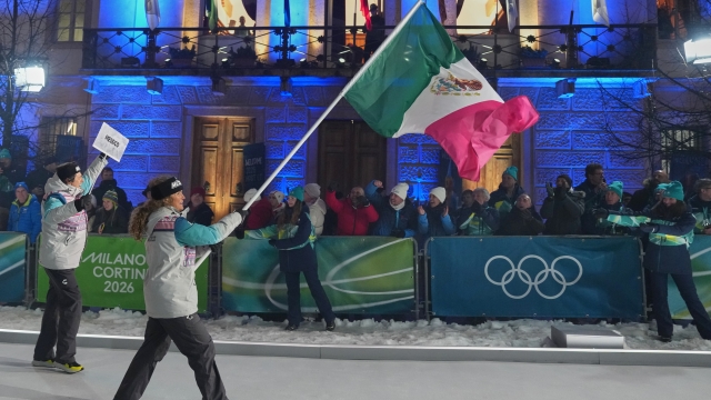Team Mexico flag bearer Sarah Schleper arrives for the Olympic opening ceremony at the 2026 Winter Olympics, in Cortina d'Ampezzo, Italy, Friday, Feb. 6, 2026. (AP Photo/Misper Apawu)