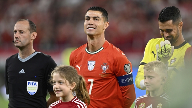 Portugal's Cristiano Ronaldo stands on the pitch before a World Cup 2026 group F qualifying soccer match between Hungary and Portugal at the Puskas Arena in Budapest, Tuesday, Sept. 9, 2025. (AP Photo/Denes Erdos)