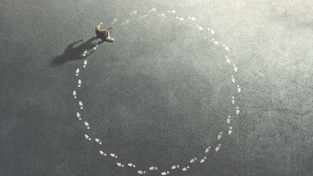 man following his footpath in circle; life concept