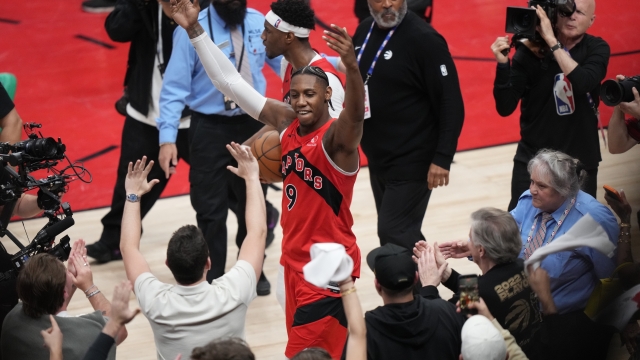 Toronto Raptors' RJ Barrett (9) celebrates with fans after a win over the Cleveland Cavaliers in Game 6 in the first round of an NBA basketball playoffs series in Toronto, Friday, May 1, 2026. (Nathan Denette/The Canadian Press via AP)