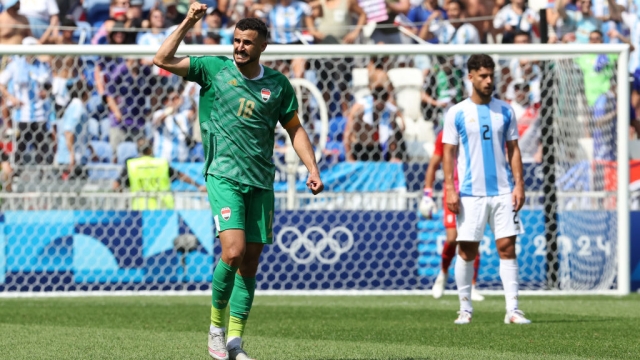  Aymen Hussein #18 of Team Iraq celebrates scoring his team's first goal during the Men's group B match between Argentina and Iraq during the Olympic Games Paris 2024 at Stade de Lyon on July 27, 2024 in Lyon, France. (Photo by Claudio Villa/Getty Images)