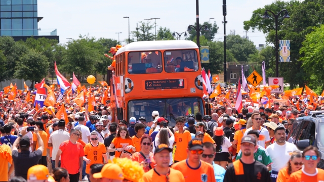 Fans conduct an "Orange Walk" to Dallas Stadium before the World Cup Group F soccer match between Japan and the Netherlands, Sunday, June 14, 2026, in Arlington, Texas. (AP Photo/LM Otero)