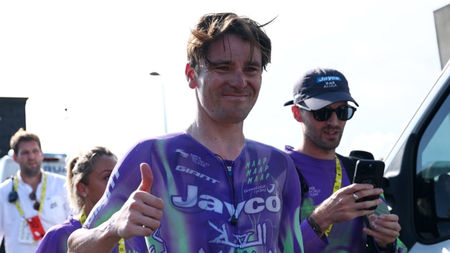 epa13117449 Swiss cyclist Mauro Schmid of Team Jayco AlUla celebrates at the finish area after winning Stage 13 of the Tour de France, a 205.8 km route from Dole to Belfort, France, 17 July 2026.  EPA/ANNE-CHRISTINE POUJOULAT / POOL