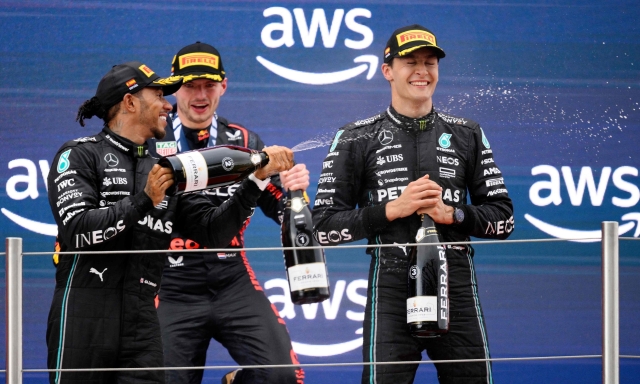 Mercedes' British driver Lewis Hamilton (L), Red Bull's Dutch driver Max Verstappen (C) and Mercedes' British driver George Russell celebrate on the podium after the Spanish Formula One Grand Prix race at the Circuit de Catalunya on June 4, 2023 in Montmelo, on the outskirts of Barcelona. (Photo by Josep LAGO / AFP)