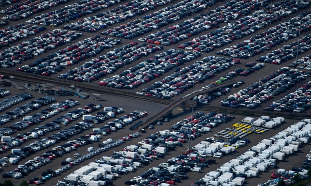 (FILES) In this file photo taken on May 08, 2020 shows an aerial view of new cars for sale at the harbour of Duisburg, western Germany. - The German car market experienced a 25% drop in July 2021, the first after four months of growth, and "the pre-crisis level is still not on the horizon" according to the VDA sector federation. (Photo by Ina FASSBENDER / AFP)