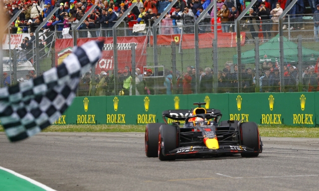 Red Bull driver Max Verstappen of the Netherlands crosses the finish line as he wins the Emilia Romagna Formula One Grand Prix, at the Enzo and Dino Ferrari racetrack in Imola, Italy, Sunday, April 24, 2022. (Guglielmo Mangiapane, Pool via AP)