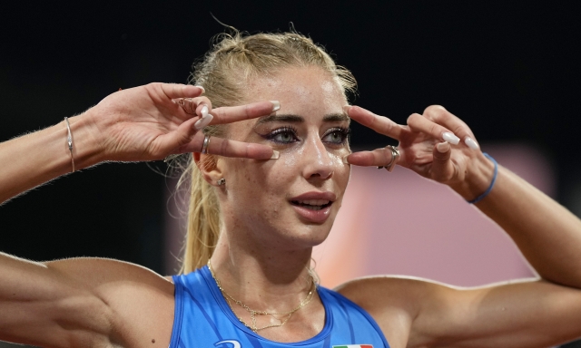Gaia Sabbatini, of Italy, gestures after finishing the Women's 1500 meters during the athletics competition in the Olympic Stadium at the European Championships in Munich, Germany, Friday, Aug. 19, 2022. (AP Photo/Martin Meissner)