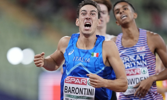 Simone Barontini, of Italy, reacts as he crosses the finish line in second place in a Men's 800 meters semifinal during the athletics competition in the Olympic Stadium at the European Championships in Munich, Germany, Friday, Aug. 19, 2022. (AP Photo/Martin Meissner)