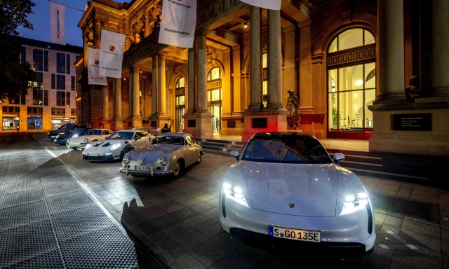 Porsche cars are lined up in front of the stock market at the start of Porsche's market listing in Frankfurt, Germany, Thursday, Sept. 29, 2022. (AP Photo/Michael Probst)