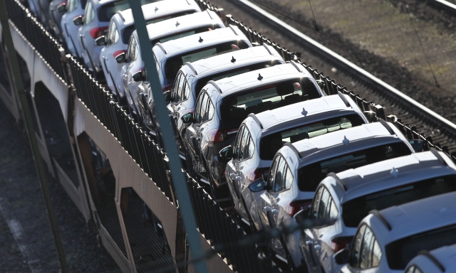 (FILES) In this file photo taken on February 23, 2022 cars are transported on a fright train at a depot in Mannheim, southwestern Germany. - German car sales fell sharply in June, official figures showed on July 7, 2022, as the sector remained gripped by supply issues. New car registrations in Europe's top economy fell by 18.1 percent year-on-year to 224,558 units in June, the federal transport authority KBA said in a statement. New car sales had already fallen by 10.2 percent in May and by 21.5 percent in April. (Photo by Daniel ROLAND / AFP)