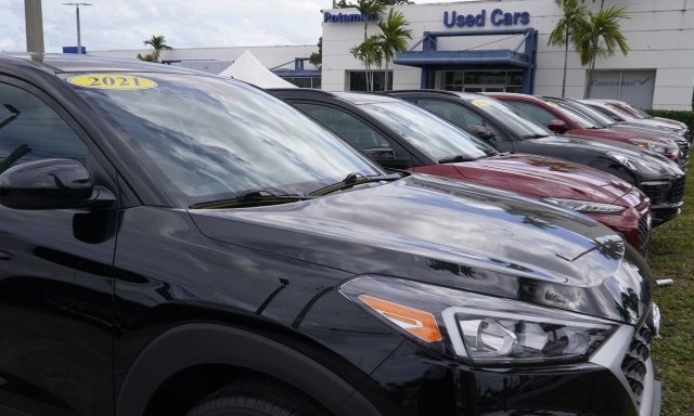A line of cars are for sale at the Potamkin Hyundai dealership used car lot, Tuesday, Feb. 1, 2022, in Miami Lakes, Fla.  U.S. new vehicle sales were expected to tumble more than 20% in the second quarter compared with a year ago as the global semiconductor shortage continued to vex the industry. Yet demand continued to outstrip supply from April through June 2022, even with $5 per gallon gasoline, rampant inflation and rising interest rates. (AP Photo/Marta Lavandier)