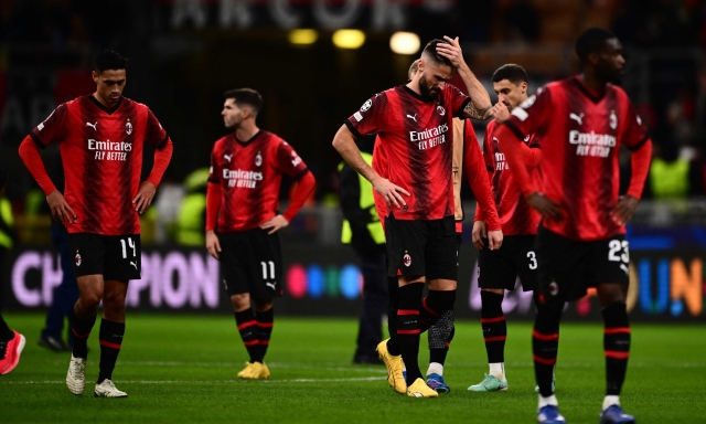 AC Milan's French forward #09 Olivier Giroud and teammates react at the end of the UEFA Champions League Group F football match between AC Milan and Borussia Dortmund at the San Siro stadium in Milan on November 28, 2023. (Photo by Marco BERTORELLO / AFP)