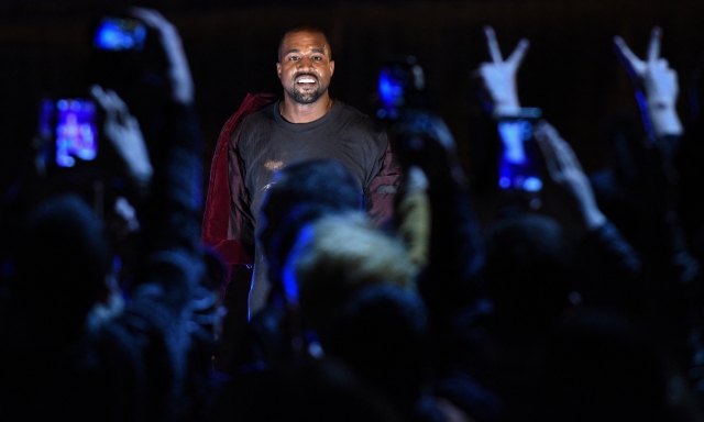 (FILES) US rapper Kanye West performs during his concert in central Yerevan on April 13, 2015. A genre, a culture and a lifestyle all at once: hip hop has traveled from the block party to the billionaire's club, soundtracked protest and celebration, and asserted seismic influence over the course of pop. The reigning music style evolved in rapid, anarchic ways, rocking the industry establishment that long resisted its power, and fully embodying the culture of youth even as it grew. This year hip hop turns 50, an anniversary that's offered its elders, its fans and the city that birthed it a milepost to reflect on its cultural weight. (Photo by KAREN MINASYAN / AFP)
