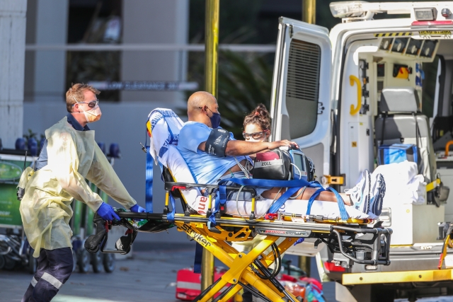  Tennis chair umpire Carlos Bernardes, guest staying at 'The View' hotel is seen being attended to by paramedics as he is stretchered into an ambulance on January 20, 2021 in Melbourne, Australia. The view hotel is one of three hotels being used for Australian Open Quarantine. All players and staff arriving in Melbourne for the Australian Open must complete 14 days of hotel quarantine and will be housed across three hotels; the Grand Hyatt, Pullman Albert Park and View Melbourne. Quarantining players will be able to leave their rooms for up to five hours a day, but only to attend dedicated quarantine training venues set up at Melbourne Park, the National Tennis Centre and Albert Reserve. Players will only be permitted to train once their day two COVID-19 comes back negative. All other staff and officials will need to remain in their rooms at all times for the 14 days of quarantine. The 2021 Australian Open will be the largest international sporting event to be held in Australia since the beginning of the coronavirus pandemic. (Photo by Asanka Ratnayake/Getty Images)