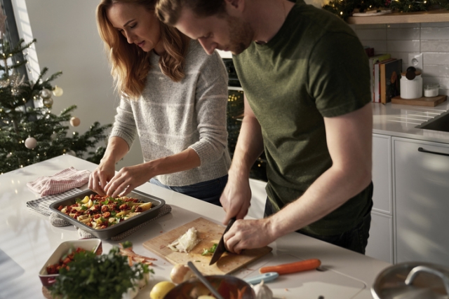 Caucasian couple cooking together  before Christmas