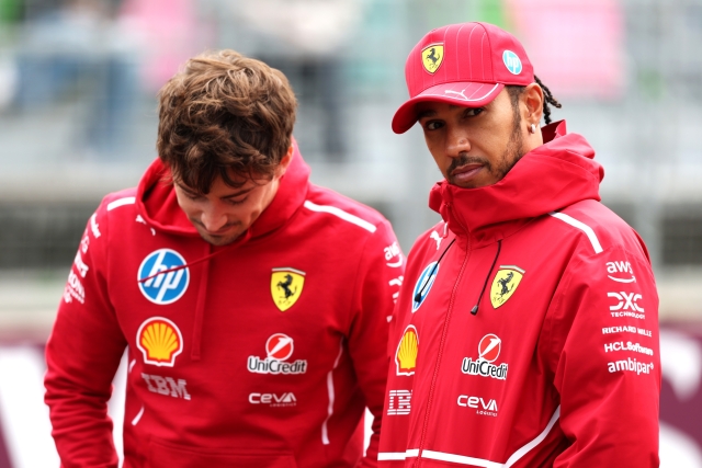  Charles Leclerc of Monaco and Scuderia Ferrari and Lewis Hamilton of Great Britain and Scuderia Ferrari talk in the Paddock prior to the F1 Grand Prix of Azerbaijan at Baku City Circuit on September 21, 2025 in Baku, Azerbaijan. (Photo by Mark Thompson/Getty Images)