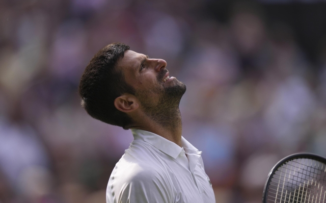 Serbia's Novak Djokovic after losing a point against Spain's Carlos Alcaraz during the men's singles final on day fourteen of the Wimbledon tennis championships in London, Sunday, July 16, 2023. (AP Photo/Alberto Pezzali)   Associated Press/LaPresse Only Italy and Spain