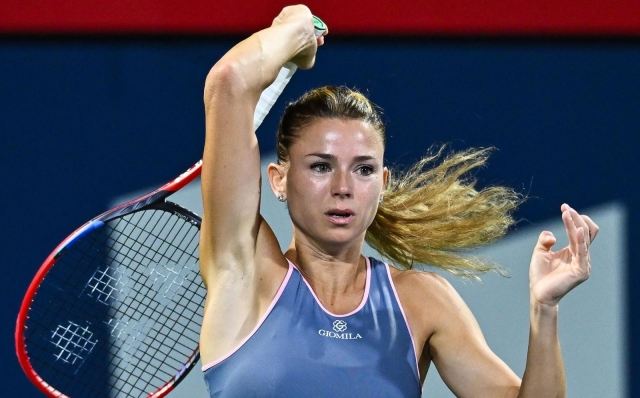 MONTREAL, CANADA - AUGUST 09: Camila Giorgi of Italy hits a return against Petra Kvitova of the Czech Republic on Day 3 during the National Bank Open at Stade IGA on August 9, 2023 in Montreal, Canada.   Minas Panagiotakis/Getty Images/AFP (Photo by Minas Panagiotakis / GETTY IMAGES NORTH AMERICA / Getty Images via AFP)