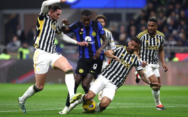 MILAN, ITALY - FEBRUARY 04: Marcus Thuram of FC Internazionale is tackled by Adrien Rabiot and Danilo of Juventus during the Serie A TIM match between FC Internazionale and Juventus - Serie A TIM  at Stadio Giuseppe Meazza on February 04, 2024 in Milan, Italy. (Photo by Marco Luzzani/Getty Images)