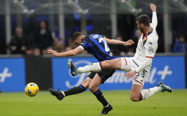 Inter Milan's Kristjan Asllani, left, scores against Genoa during a Serie A soccer match between Inter Milan and Genoa at the San Siro stadium in Milan, Italy, Monday, March 4, 2024. (AP Photo/Luca Bruno)