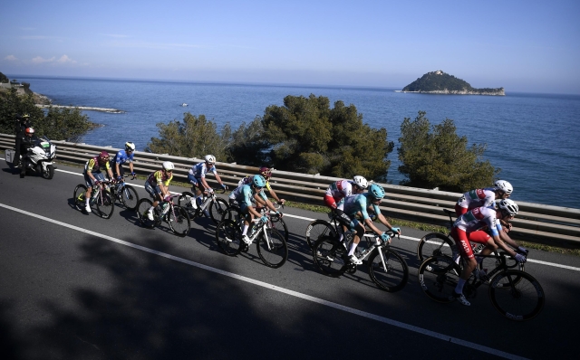The pack rides during the men's elite race of the Milano-Sanremo one day cycling race (288km) from Pavia and to Sanremo - North West Italy- Saturday, March 16, 2024. Sport - cycling . (Photo by Fabio Ferrari/Lapresse)