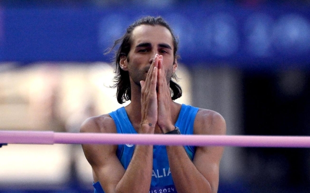 Gianmarco Tamberi of Italy competes in the Men's High Jump qualification of the Athletics competitions in the Paris 2024 Olympic Games, at the Stade de France stadium in Saint Denis, France, 07 August 2024. ANSA/ETTORE FERRARI