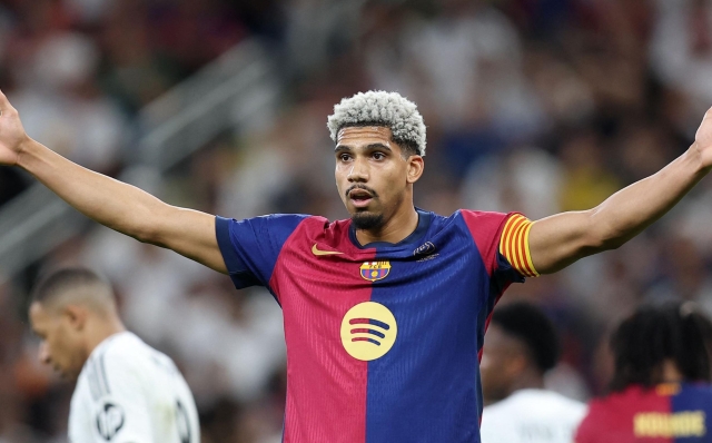 Barcelona's Uruguayan defender #4 Ronald Federico Araujo da Silva reacts during the Spanish Super Cup final football match between Real Madrid and Barcelona at the King Abdullah Sport City in Jeddah on January 12, 2025. (Photo by Haitham AL-SHUKAIRI / AFP)