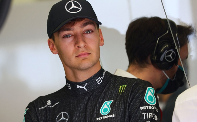 Mercedes' British driver George Russell looks on during the first day of Formula One (F1) pre-season testing at the Bahrain International Circuit in the city of Sakhir on March 10, 2022. (Photo by Giuseppe CACACE / AFP)