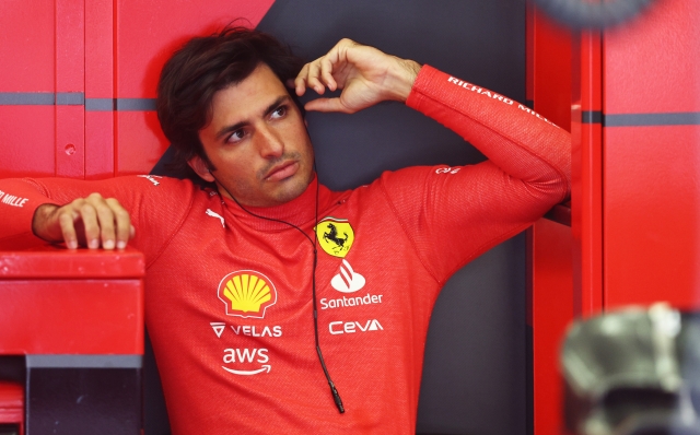 BAHRAIN, BAHRAIN - MARCH 18: Carlos Sainz of Spain and Ferrari looks on in the garage during practice ahead of the F1 Grand Prix of Bahrain at Bahrain International Circuit on March 18, 2022 in Bahrain, Bahrain. (Photo by Lars Baron/Getty Images)