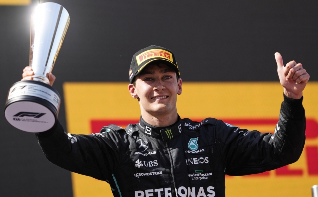 epa09966440 Third placed British George Russell of Mercedes celebrates on the podium after the Formula One Grand Prix of Spain held at Circuit Barcelona-Catalunya in Montmelo, Barcelona, Spain, 22 May 2022.  EPA/Alejandro Garcia