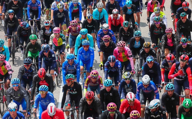 The pack rides during the seventh stage of the Giro d'Italia 2023 cycling race, 218 km between Capua and Gran Sasso d'Italia, on May 12, 2023. (Photo by Luca Bettini / AFP)