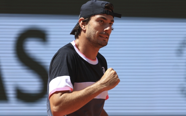 Italy's Giulio Zeppieri clenches his fist after scoring a point against Norway's Casper Ruud during their second round match of the French Open tennis tournament at the Roland Garros stadium in Paris, Thursday, June 1, 2023. (AP Photo/Aurelien Morissard)