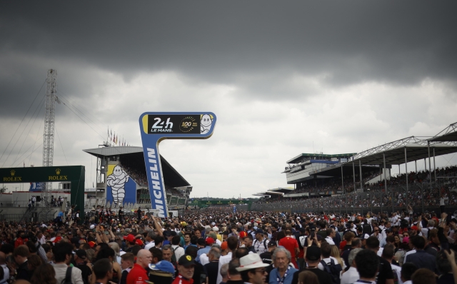 epa10683331 Spectators attend the grid walk before the 91th edition of 24 Hours of Le Mans, France, 10 June 2023. The race celebrates 100 anniversary of the first edition held in 1923.  EPA/YOAN VALAT