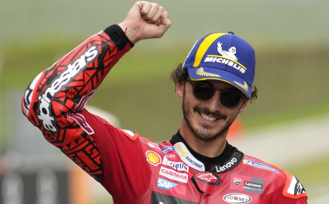 Italy's Francesco Bagnaia celebrates after winning the sprint race for the MotoGP Grand Prix of Italy at the Mugello circuit in Scarperia, Italy, Saturday, June 10, 2023. (AP Photo/Luca Bruno)