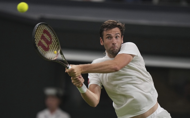 Quentin Halys of France plays a return to Britain's Daniel Evans during the first round men's singles match on day two of the Wimbledon tennis championships in London, Tuesday, July 4, 2023. (AP Photo/Alberto Pezzali)