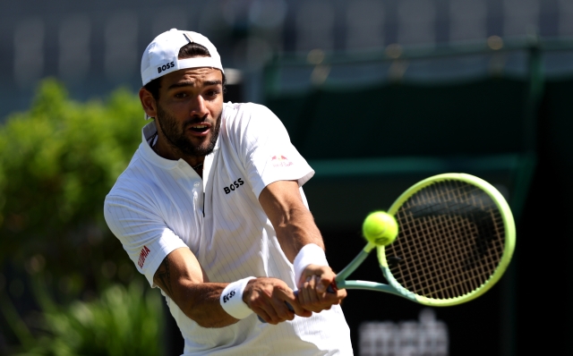 LONDON, ENGLAND - JULY 07: Matteo Berrettini of Italy plays a backhand against Alex De Minaur of Australia in the Men's Singles second round match  during day five of The Championships Wimbledon 2023 at All England Lawn Tennis and Croquet Club on July 07, 2023 in London, England. (Photo by Clive Brunskill/Getty Images)