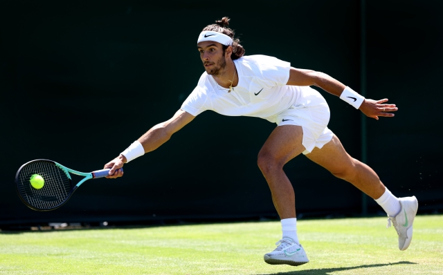 LONDON, ENGLAND - JULY 07: Lorenzo Musetti of Italy plays a forehand  against Hubert Hurkacz of Poland in the Men's Singles third round match during day five of The Championships Wimbledon 2023 at All England Lawn Tennis and Croquet Club on July 07, 2023 in London, England. (Photo by Michael Regan/Getty Images)