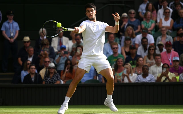 LONDON, ENGLAND - JULY 10: Carlos Alcaraz of Spain plays a forehand against Matteo Berrettini of Italy in the Men's Singles fourth round match during day eight of The Championships Wimbledon 2023 at All England Lawn Tennis and Croquet Club on July 10, 2023 in London, England. (Photo by Mike Hewitt/Getty Images)