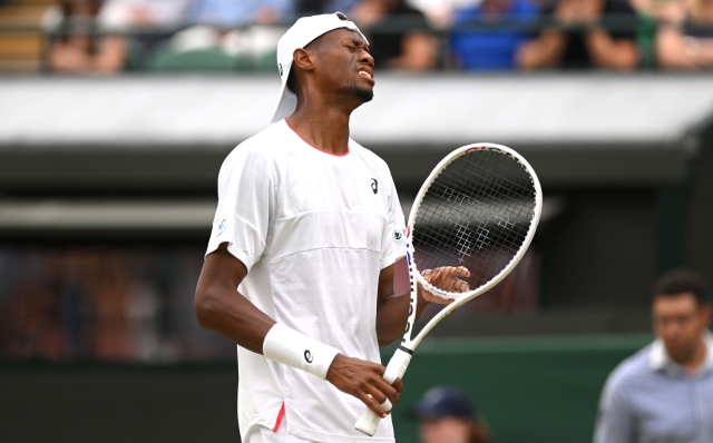 LONDON, ENGLAND - JULY 12: Christopher Eubanks of United States reacts against Daniil Medvedev in the Men's Singles Quarter Final match during day ten of The Championships Wimbledon 2023 at All England Lawn Tennis and Croquet Club on July 12, 2023 in London, England. (Photo by Mike Hewitt/Getty Images)
