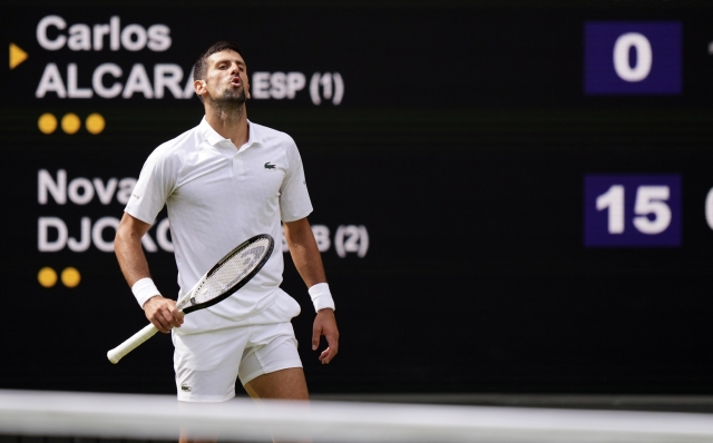 Serbia's Novak Djokovic in action against Spain's Carlos Alcaraz during the men's singles final on day fourteen of the Wimbledon tennis championships in London, Sunday, July 16, 2023. (AP Photo/Alberto Pezzali)   Associated Press/LaPresse Only Italy and Spain