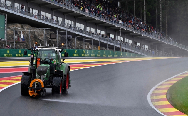 A technical vehicle blow air to clear rainwater from the track before the sprint shootout ahead of the Formula One Belgian Grand Prix at the Spa-Francorchamps Circuit in Spa on July 29, 2023. (Photo by JOHN THYS / POOL / AFP)