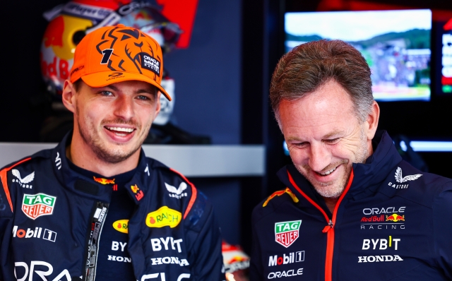 SPA, BELGIUM - JULY 30: Max Verstappen of the Netherlands and Oracle Red Bull Racing and Red Bull Racing Team Principal Christian Horner talk in the garage prior to the F1 Grand Prix of Belgium at Circuit de Spa-Francorchamps on July 30, 2023 in Spa, Belgium. (Photo by Mark Thompson/Getty Images)