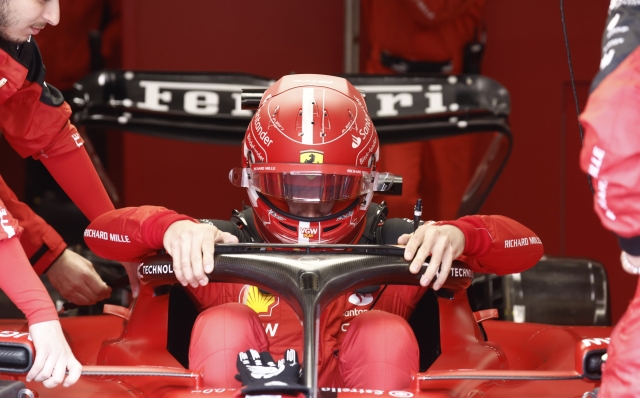 Ferrari driver Charles Leclerc of Monaco gets into his car during the Formula One Grand Prix at the Spa-Francorchamps racetrack in Spa, Belgium, Sunday, July 30, 2023. (Simon Wohlfahrt, Pool Photo via AP)