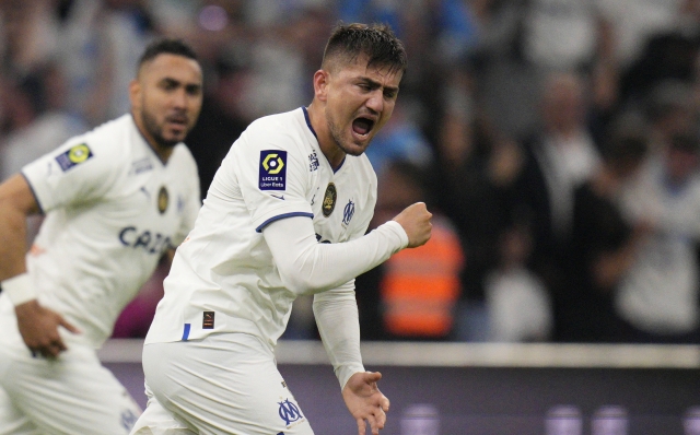 Marseille's Cengiz Under celebrates after scoring his side's opening goal during the French League One soccer match between Marseille and Auxerre at the Velodrome stadium in Marseille, France, Sunday, April 30, 2023. (AP Photo/Daniel Cole)