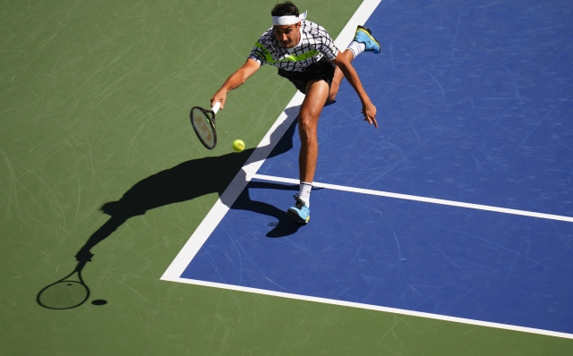 Lorenzo Sonego, of Italy, returns a shot to Jannik Sinner, of Italy, during the second round of the U.S. Open tennis championships, Thursday, Aug. 31, 2023, in New York. (AP Photo/Manu Fernandez)