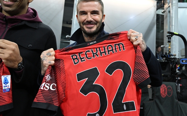 MILAN, ITALY - NOVEMBER 07:  David Beckham poses with a jersey before the UEFA Champions League match between AC Milan and Paris Saint-Germain at Stadio Giuseppe Meazza on November 07, 2023 in Milan, Italy. (Photo by Claudio Villa/AC Milan via Getty Images)