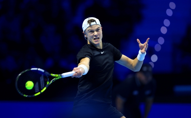 TURIN, ITALY - NOVEMBER 16: Holger Rune of Denmark plays a forehand against Jannik Sinner of Italy during the Men's Singles Round Robin match on day five of the Nitto ATP Finals at Pala Alpitour on November 16, 2023 in Turin, Italy. (Photo by Clive Brunskill/Getty Images)