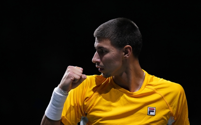 Alexei Popyrin of Australia reacts after winning a point against Matteo Arnaldi of Italy during a Davis Cup final tennis match between Australia and Italy in Malaga, Spain, Sunday, Nov. 26, 2023. (AP Photo/Manu Fernandez)
